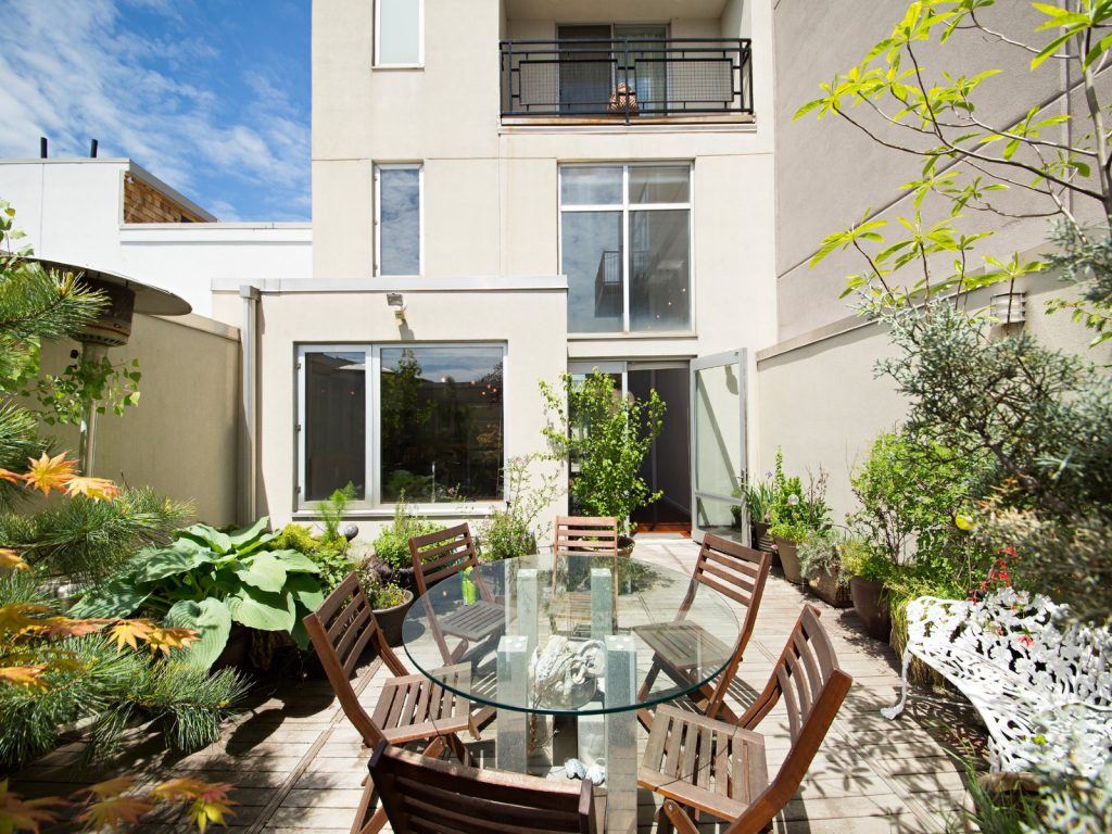 This modern 4.5M townhouse by the Williamsburg waterfront has an art studio, parking and four