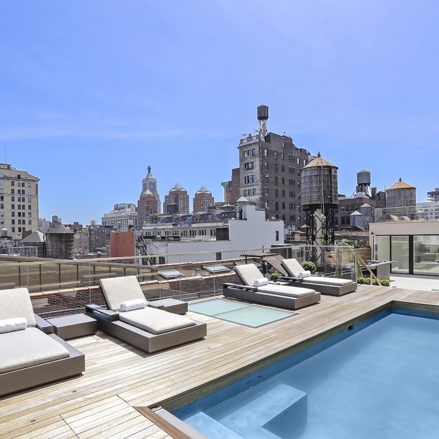 The massive roof deck at this $15.5M Flatiron penthouse has a 20-foot pool and full bar