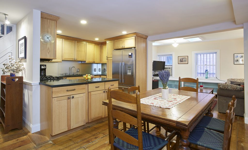 Step back in time in this charming row house on Washington Height's