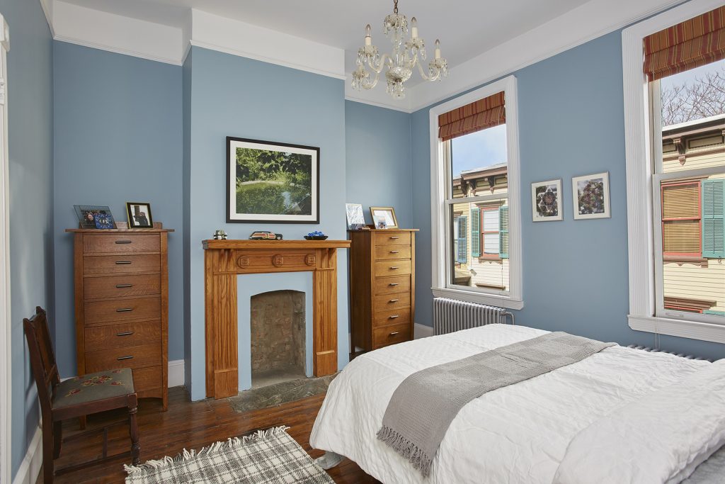 Step back in time in this charming row house on Washington Height's