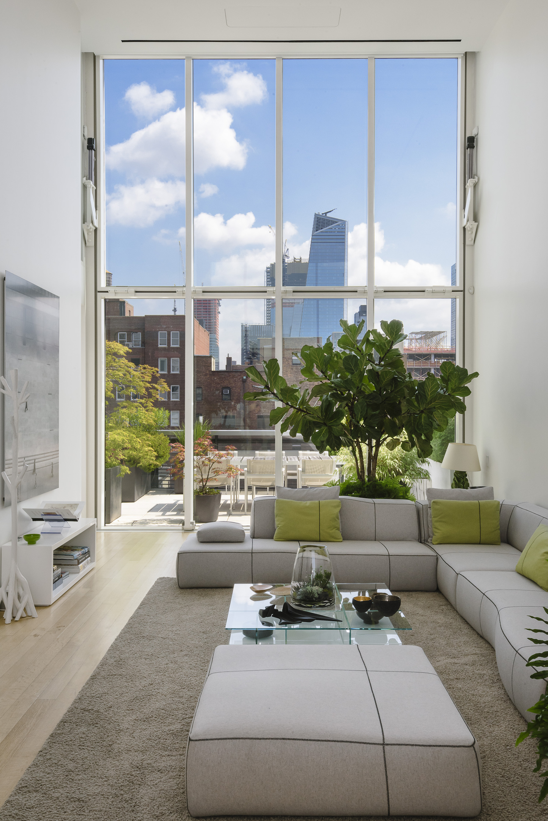 $8.9M Chelsea penthouse has a movable glass wall, four terraces, and a ...