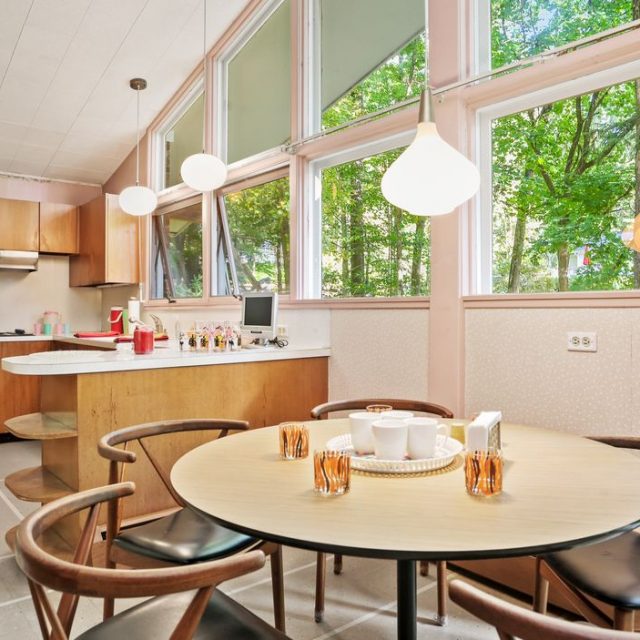 For $1.1M, a mid-century time capsule in Connecticut with pink accents and a retro bar